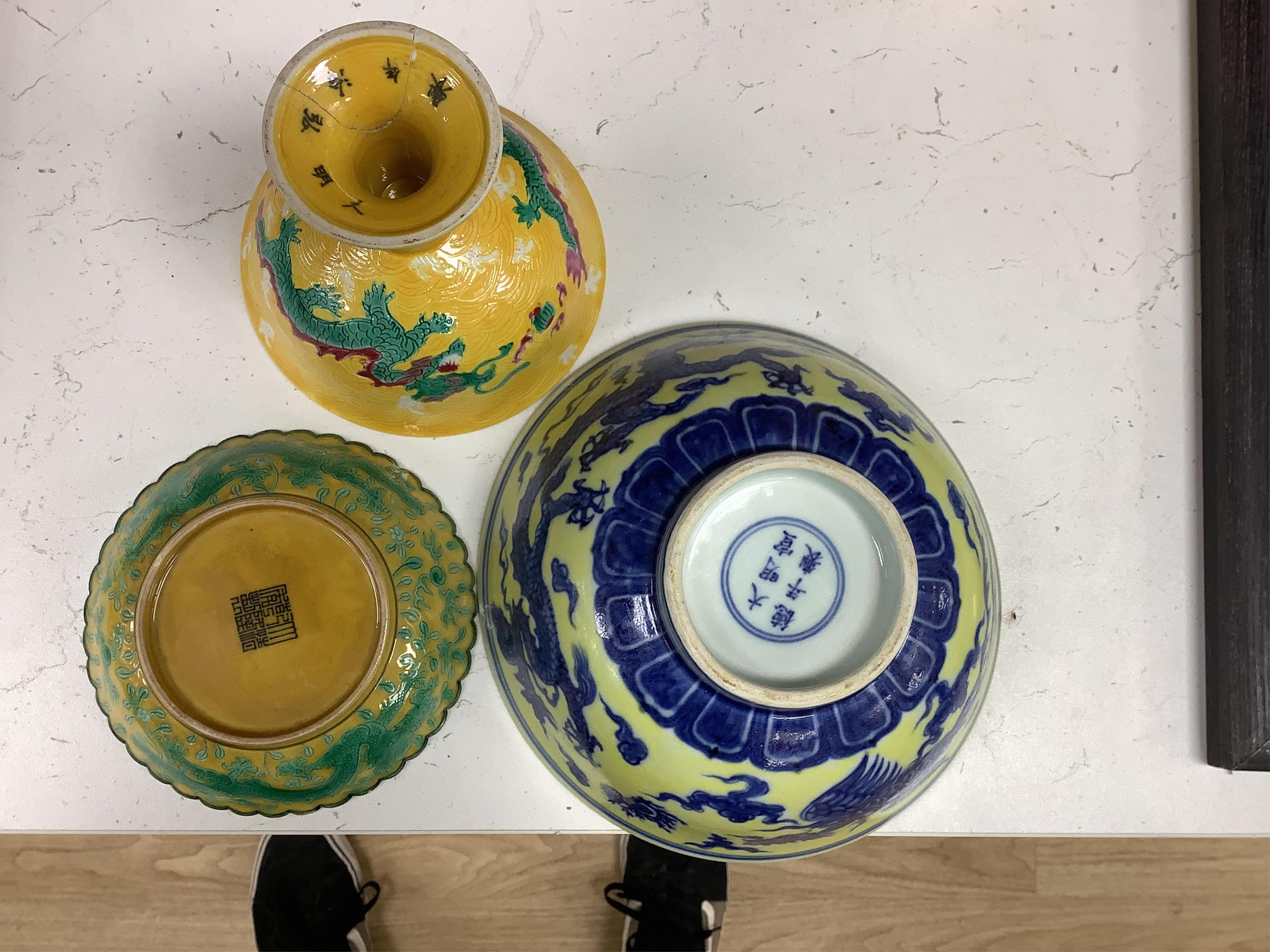 A Chinese yellow ground underglaze blue 'dragon' bowl, boxed, a yellow and green 'dragon' dish and a similar stem cup, yellow bowl 19.5cm diameter. Condition - good